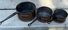 Antique French Hammered Copper Saucepans picture