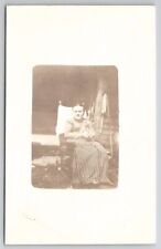 RPPC Wonderful Woman Holding Teddy Bear Sitting In Rocking Chair Postcard Q22 picture