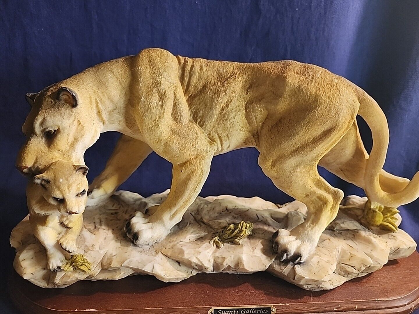 Suanti Galleries Vintage Lioness Carrying Her Cub
