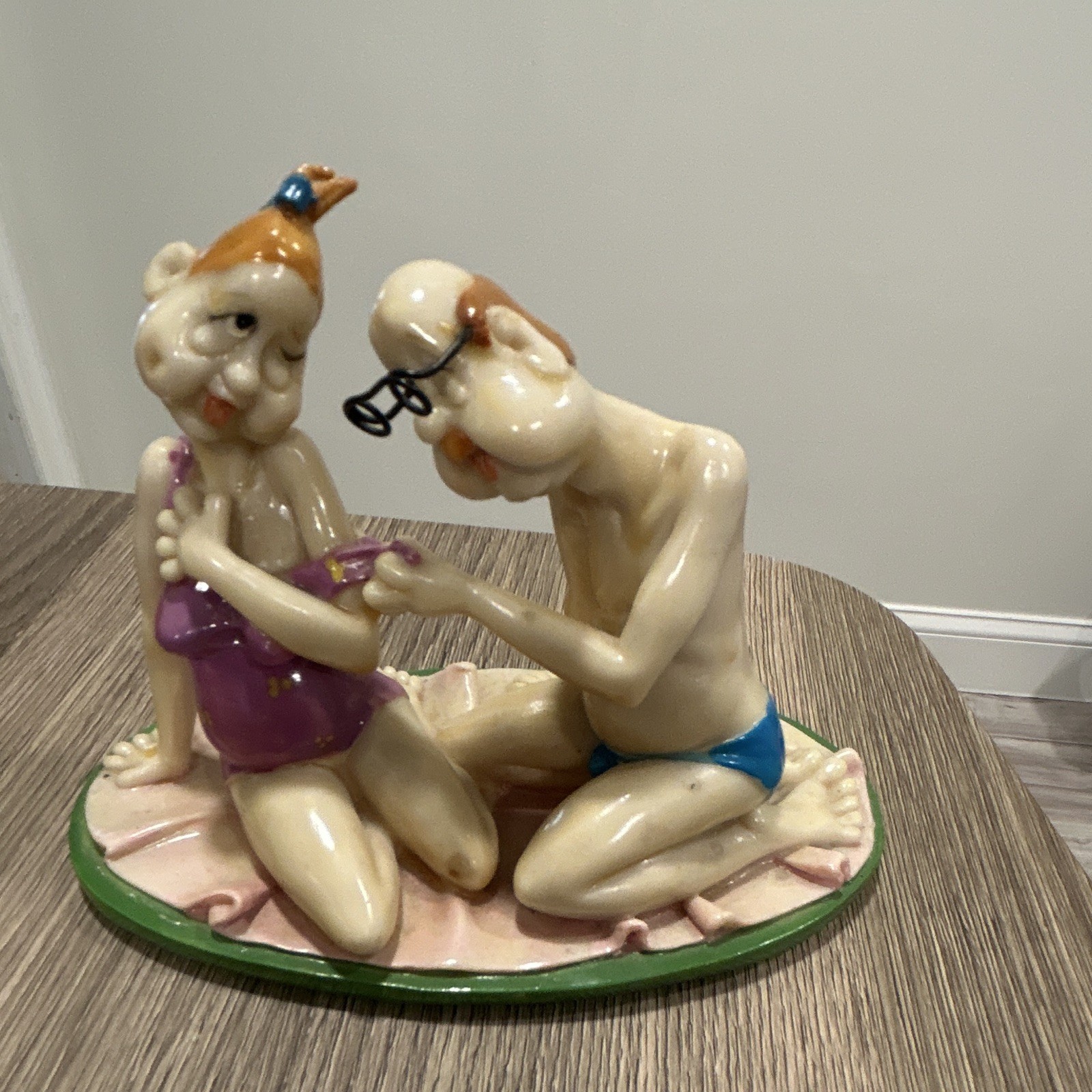 Glazed Ceramic Couple On Beach