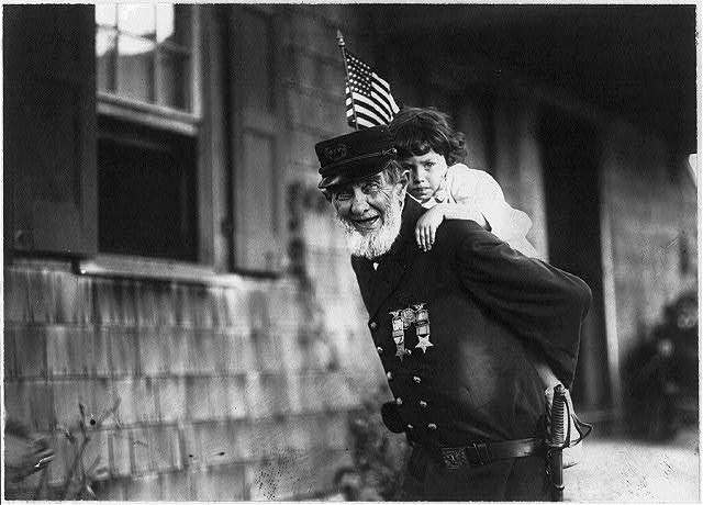 Photo:G.A.R. Veteran Child Riding Back 1914 Off to the Celebration