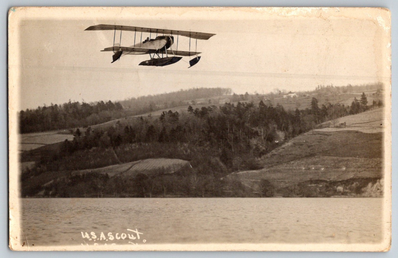 Vintage RPPC WWI Biplane USAS Scout Seaplane Flying Over River Military Aircraft Vintage RPPC WWI Biplane USAS Scout Seaplane Flying Over River Military Aircraft