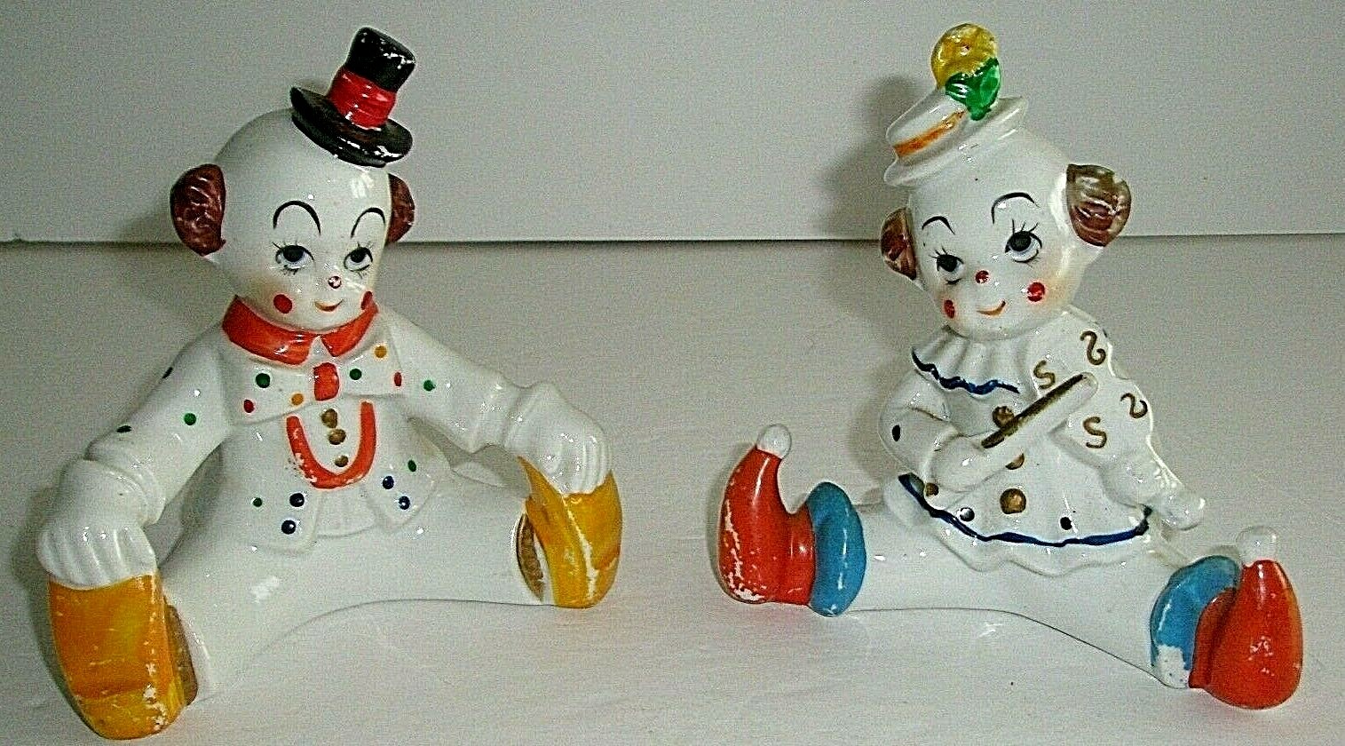 Porcelain Clown Sitting Down set of 2 Child like Smiling Face 