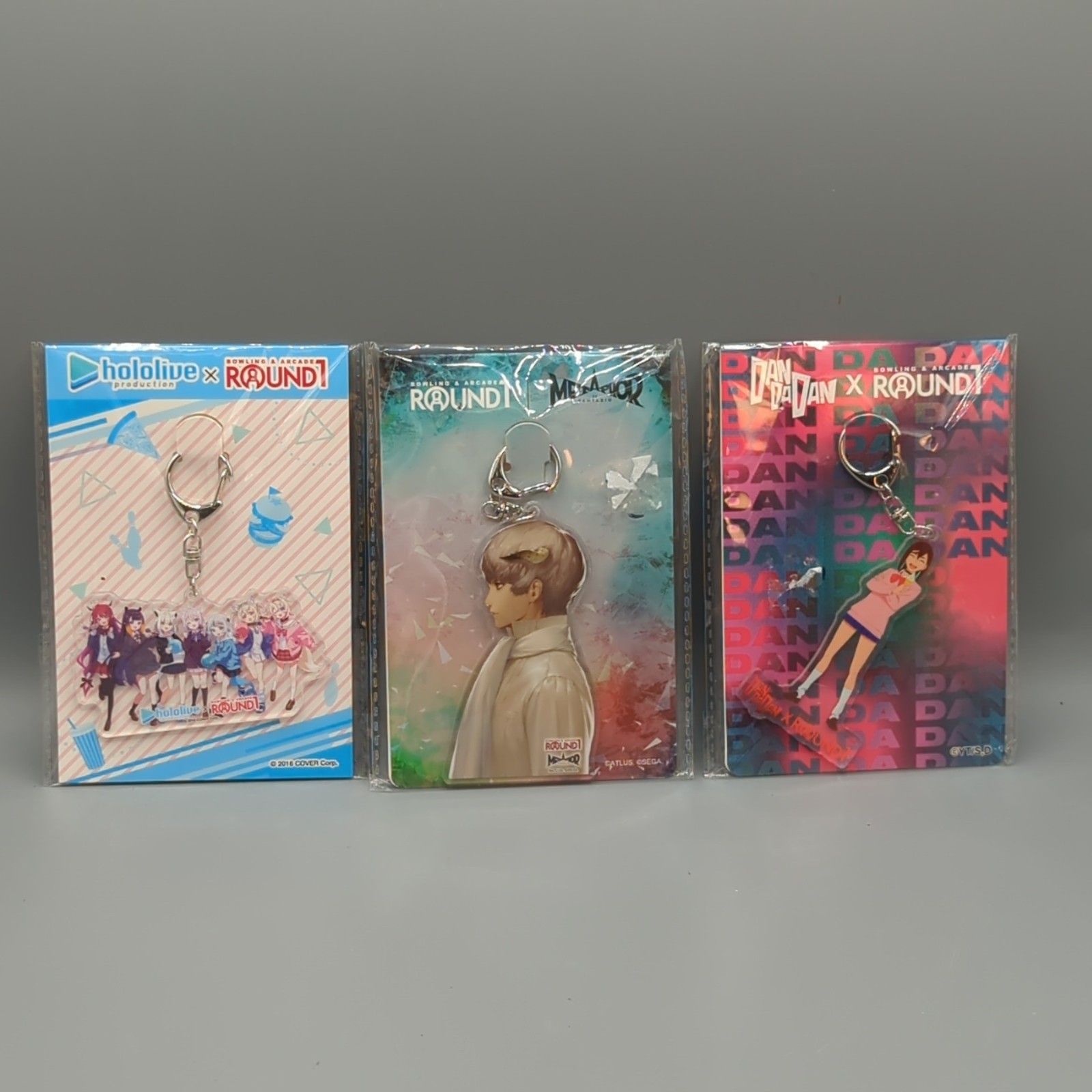 3x Round 1 x Hololive, Metaphor, Dan Da Dan Collab Exclusive Limited Keychain