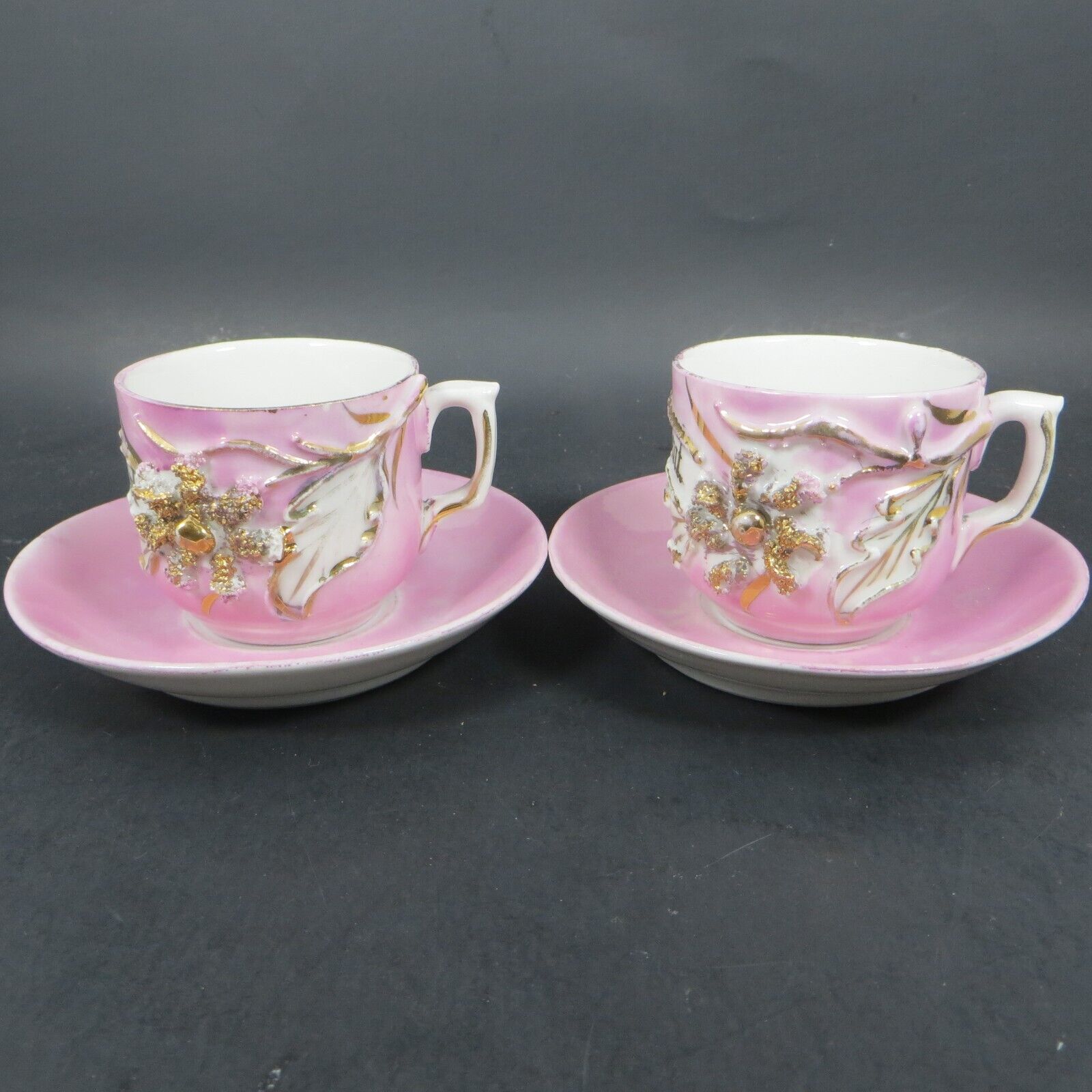 Set Of 2 Antique German Teacup and Saucer Lusterware Pink and Gold Flower Raised