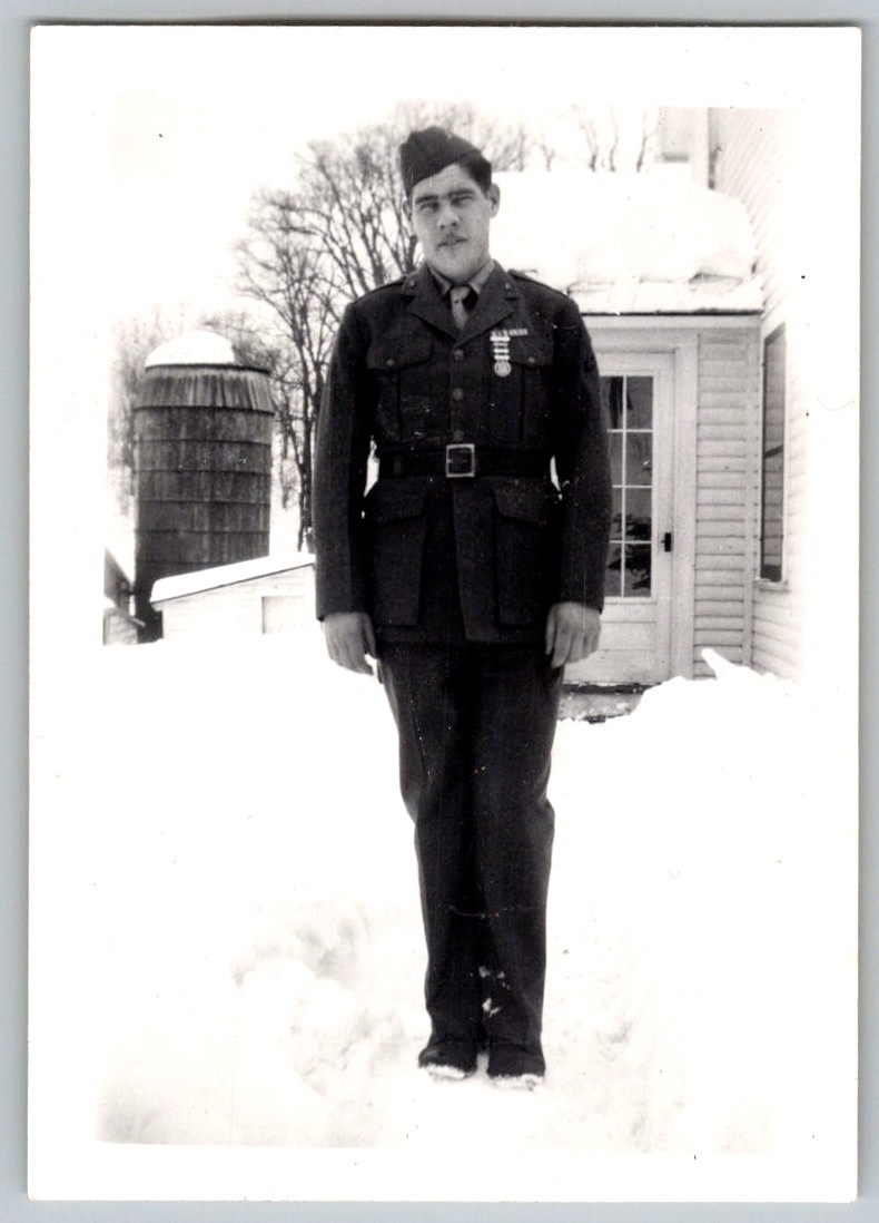 Vtg B&W Snapshot WWII Soldier in Uniform Standing in Snow By Barn Silo 1940s