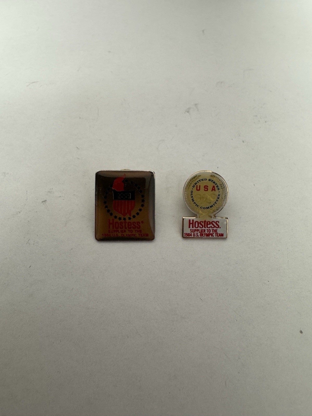 Lot Of 2 Vintage 1984 Olympic Team Enamel Lapel Pins Sponsored Hostess Cupcakes Lot Of 2 Vintage 1984 Olympic Team Enamel Lapel Pins Sponsored Hostess Cupcakes