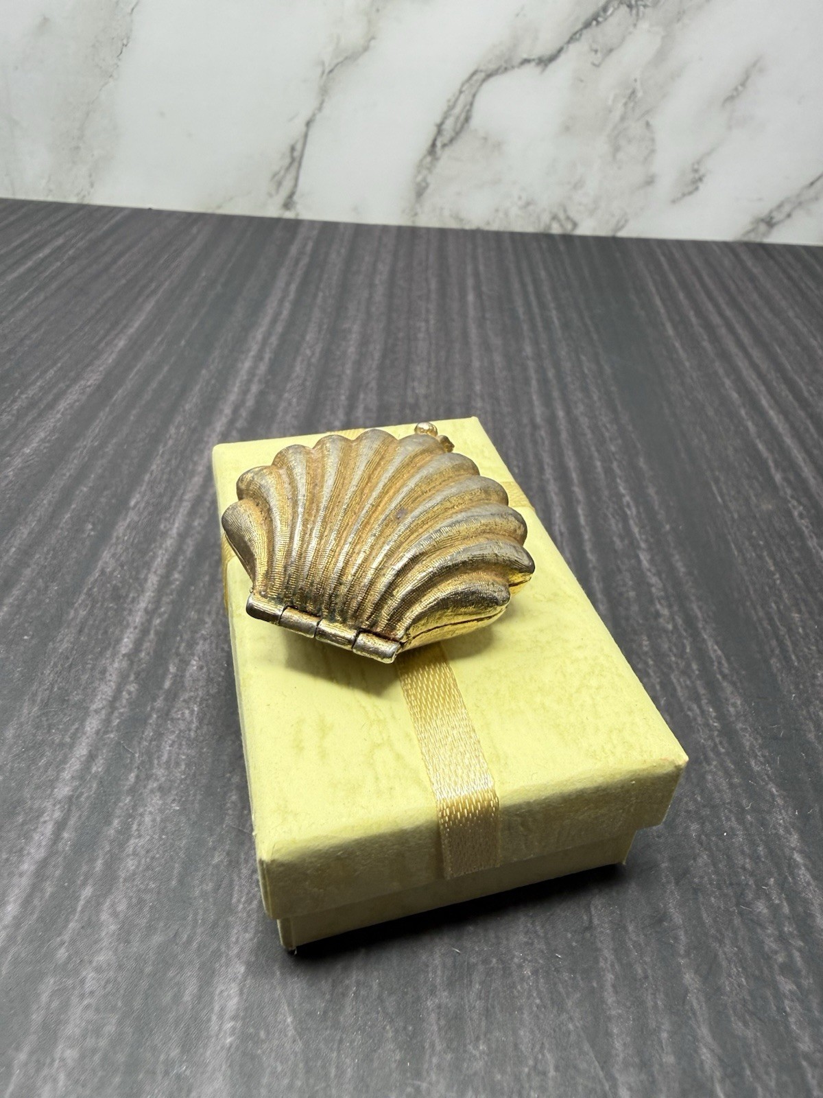 VINTAGE GIVENCHY GOLD TONE CLAM SHELL SOLID PERFUME COMPACT