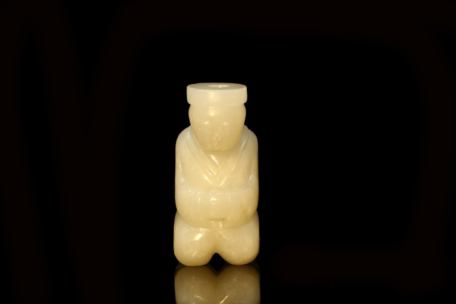 A Carved Jade Figurine A Carved Jade Figurine