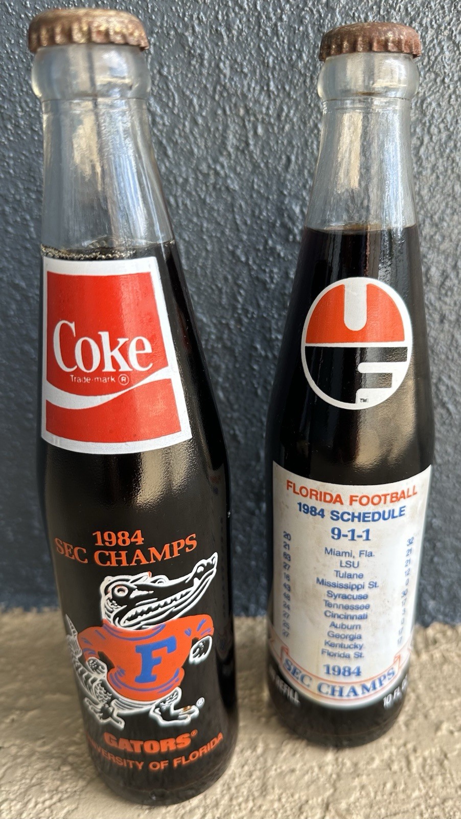Vintage Florida Gators Champs Two Full 10 ounce Coke Glass Bottles 1984