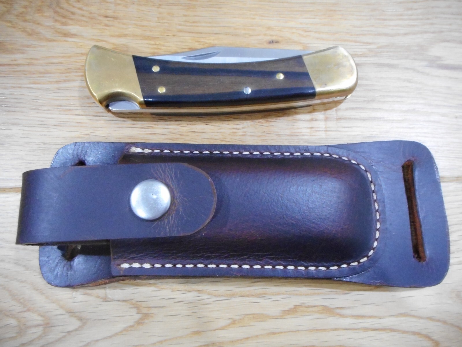 Buck 110 Horizontal draw leather knife sheath .  Crazy Horse Brown leather.