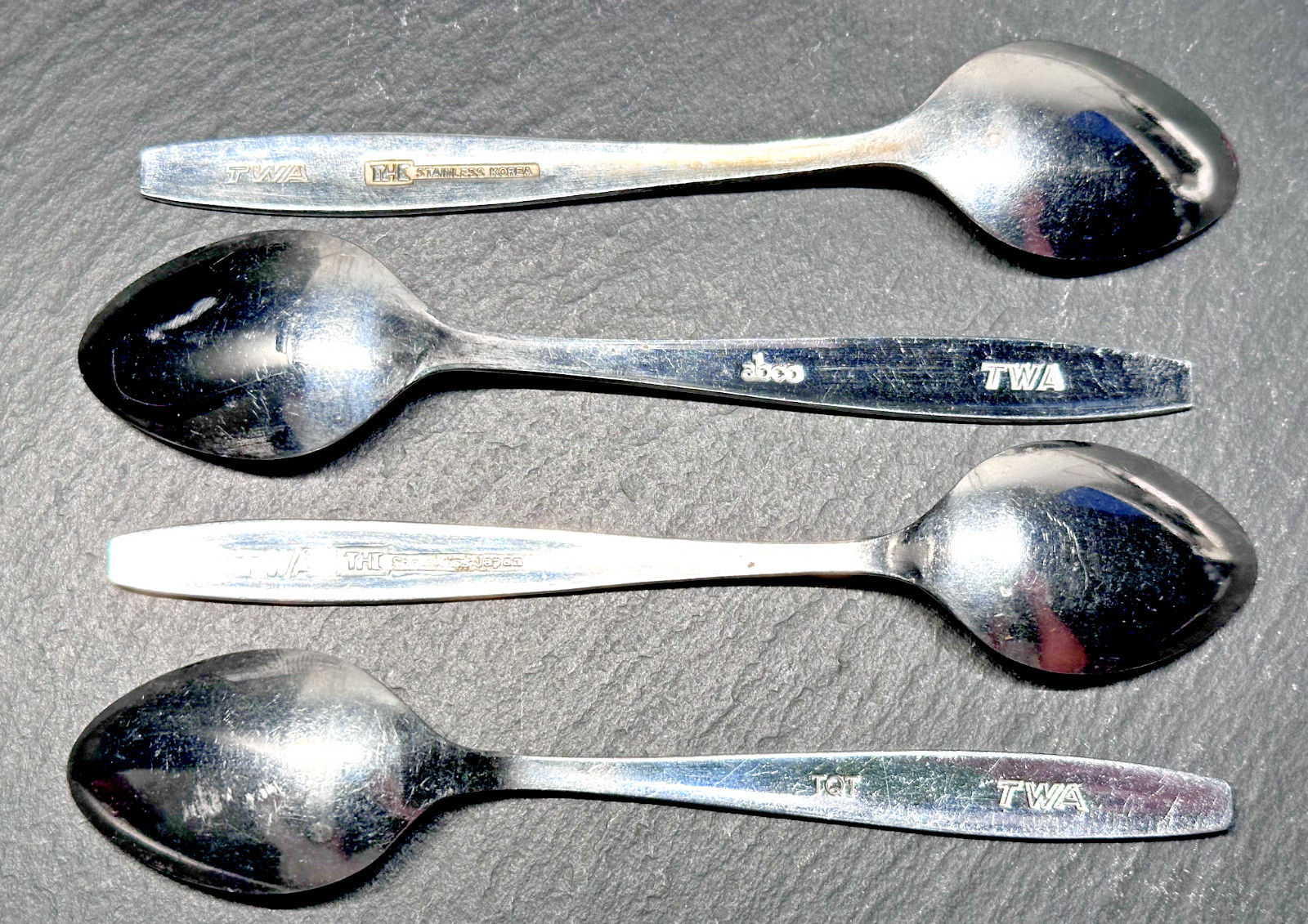 FOUR TWA TRANS WORLD AIRLINE SPOONS FLATWARE: FOUR DIFFERENT MANUFACTURERS FOUR TWA TRANS WORLD AIRLINE SPOONS FLATWARE: FOUR DIFFERENT MANUFACTURERS
