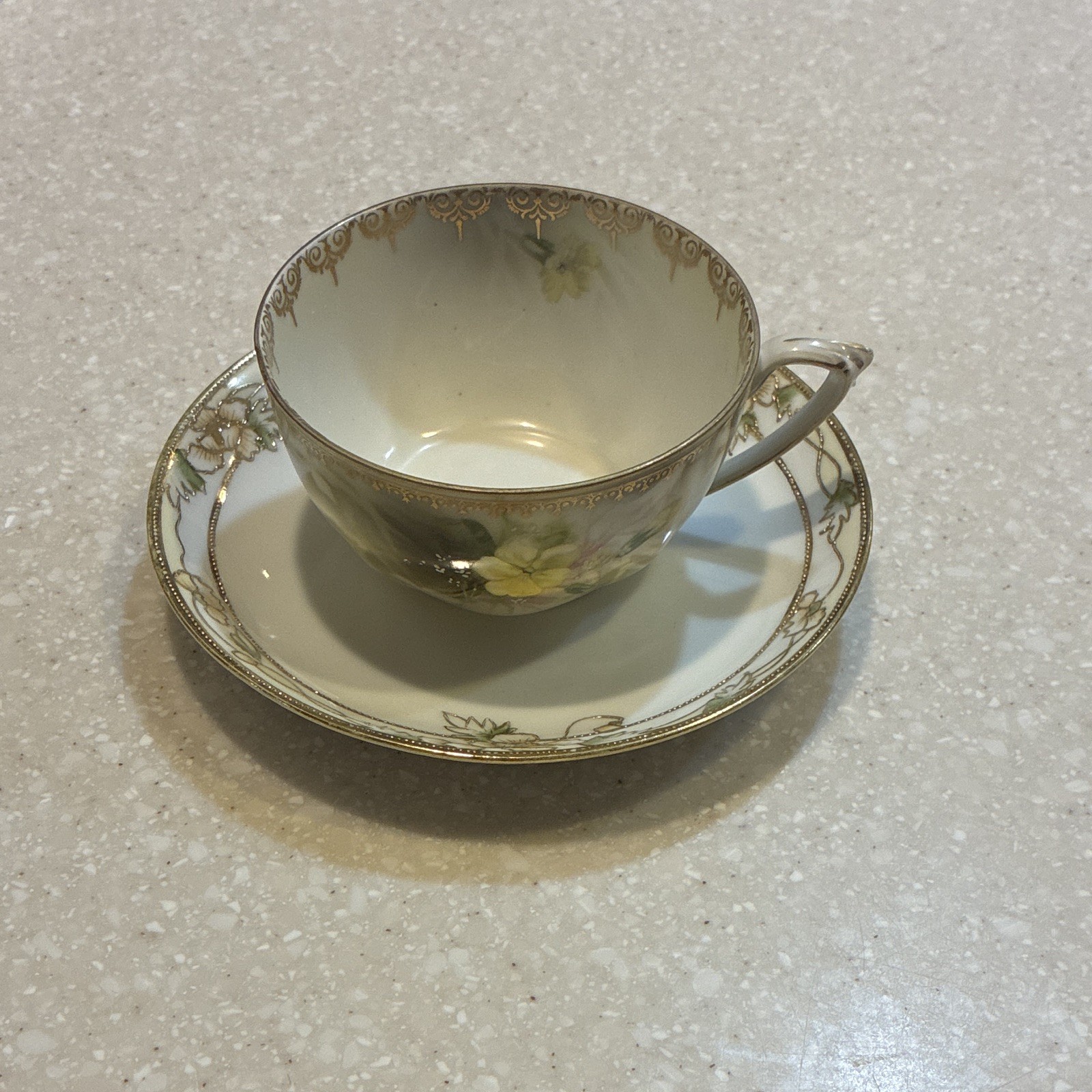White Porcelain Teacup And Saucer Made In Prussia With Gold Accents White Porcelain Teacup And Saucer Made In Prussia With Gold Accents