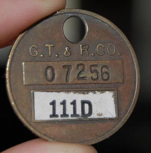 VINTAGE GOODYEAR TIRE & RUBBER  G.T. & R. BRASS ADVERTISING TAG AKRON OHIO