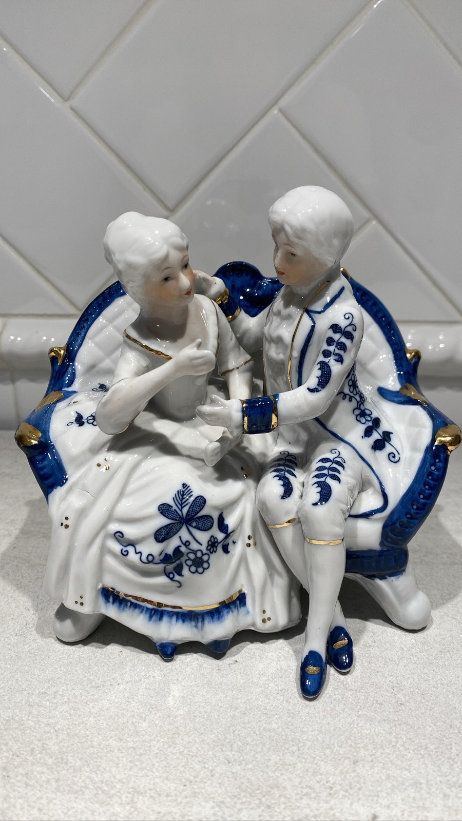 Porcelain Colonial Couple Figurine Blue White Gold Trim Seated on Sofa