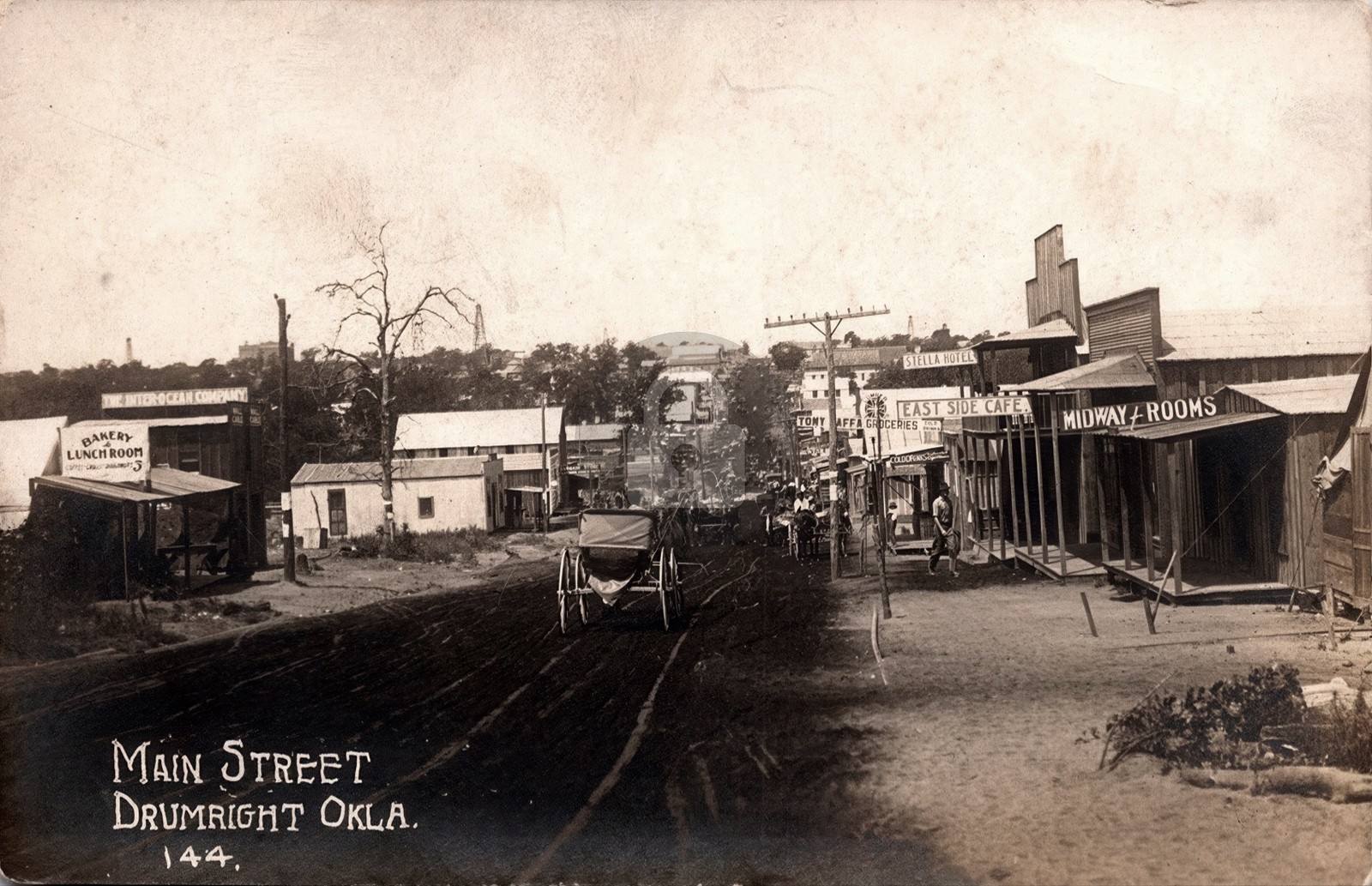Drumright OK Main Street Busy Business Dist. Signs Wagons RPPC Postcard COPY Drumright OK Main Street Busy Business Dist. Signs Wagons RPPC Postcard COPY