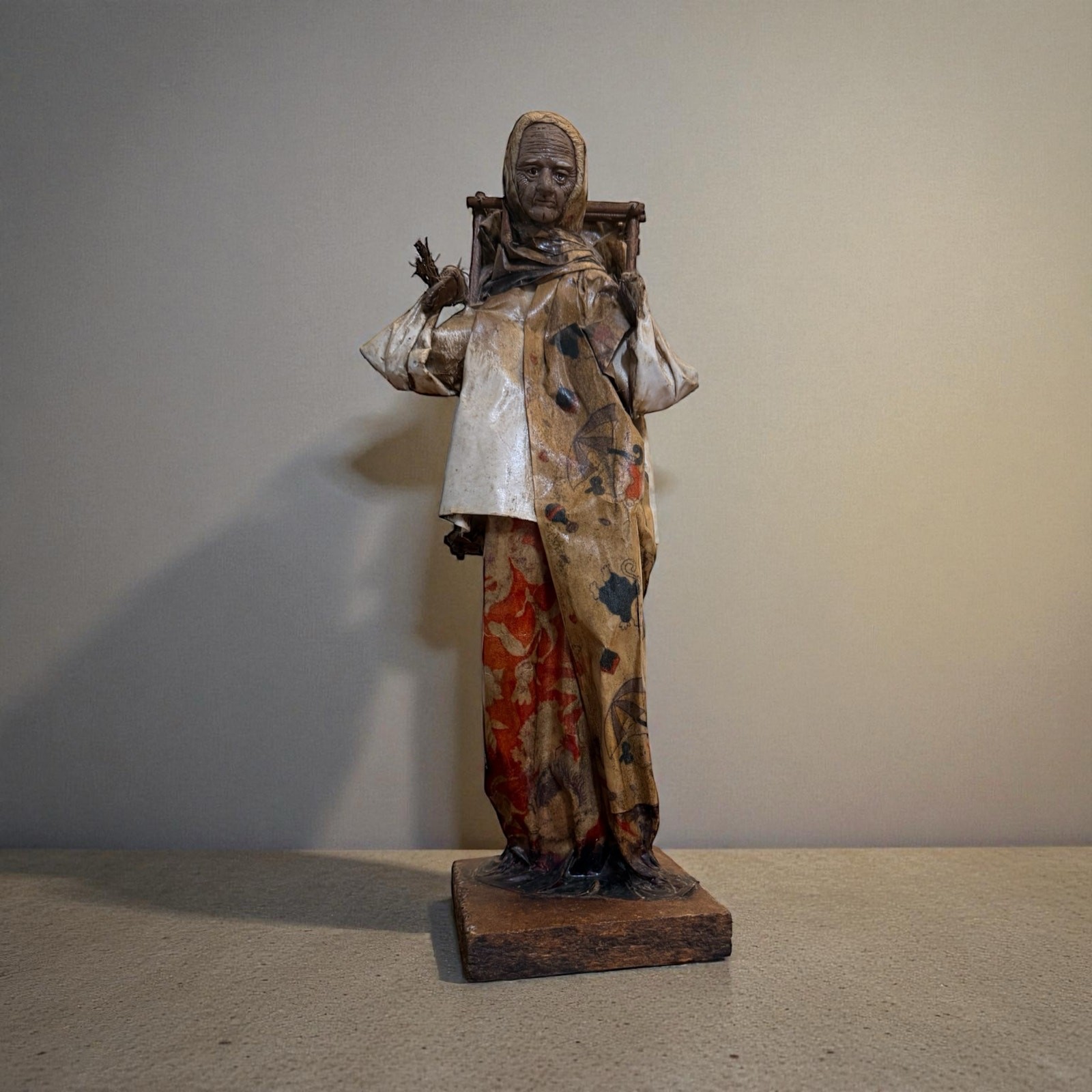 Mexican folk art paper mache figurine of an old village woman. 