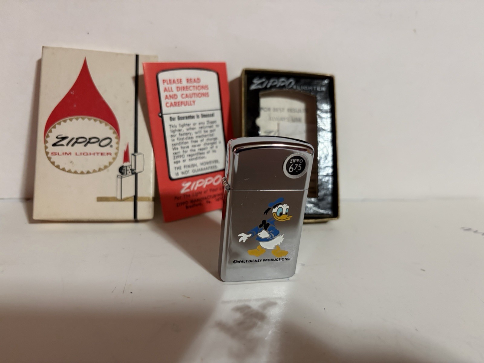 DONALD DUCK 1975 VINTAGE ZIPPO LIGHTER BRADFORD PA. NIB  W/ALL PAPERWORK RARE