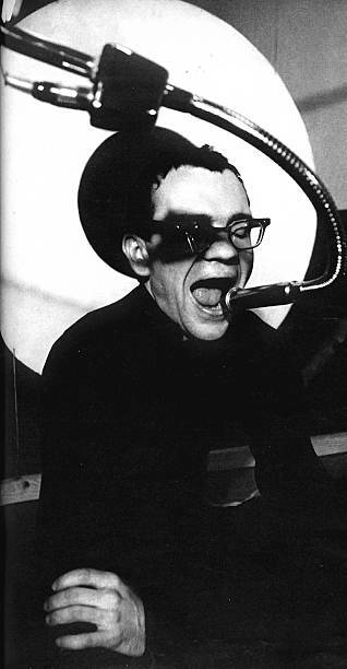avant-garde composer and musician La Monte Young performs on stage- Old Photo