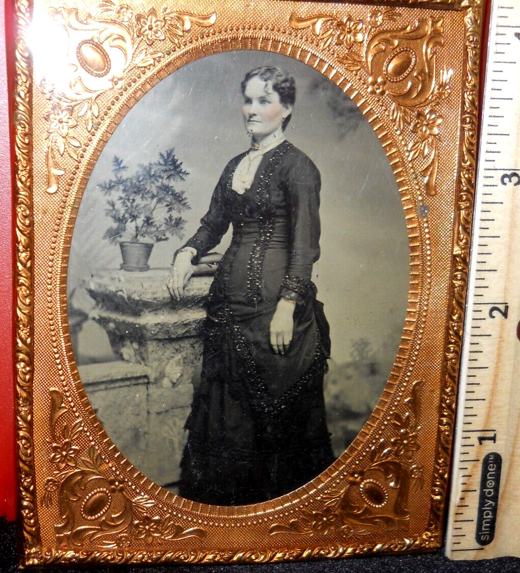 Quarter plate size Tintype of young lady in brass mat/frame