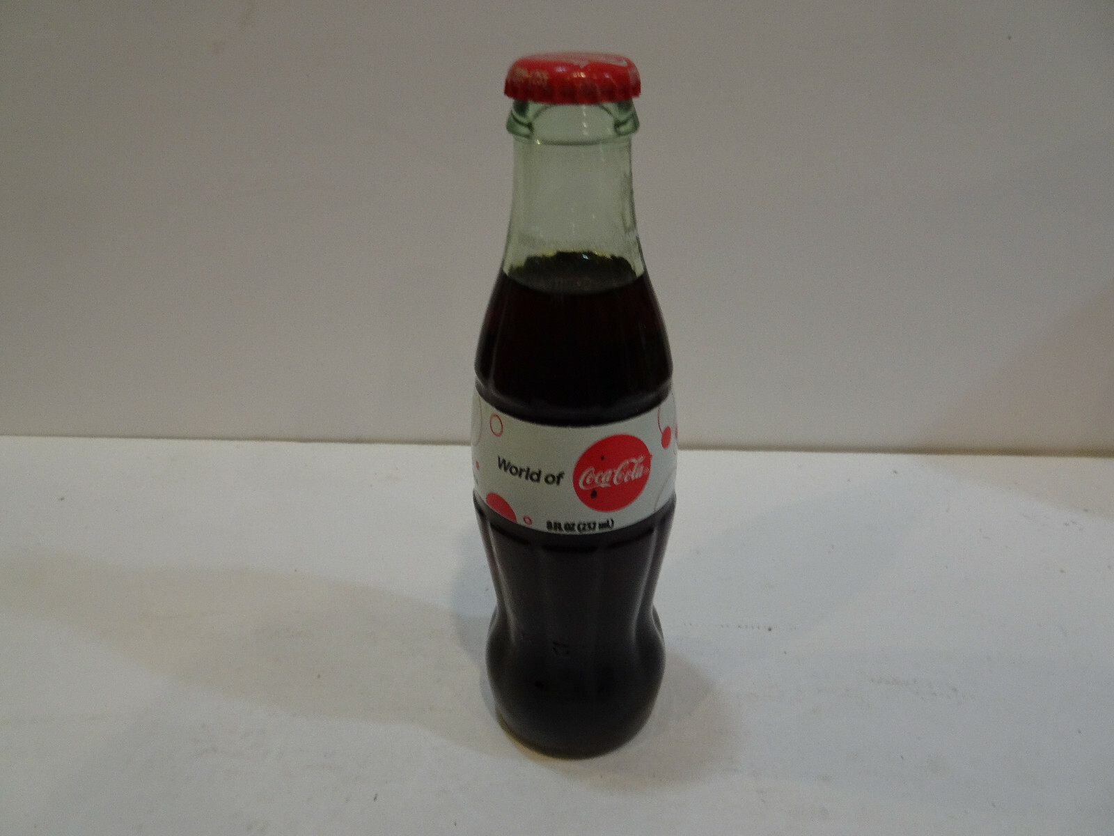2009  World of  Glass Coca Cola  bottle   Very  Good Condition & Full