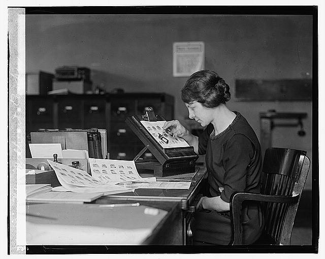 Photo:Mrs. Millicent Cooper 1923 woman at desk in office checking proofs