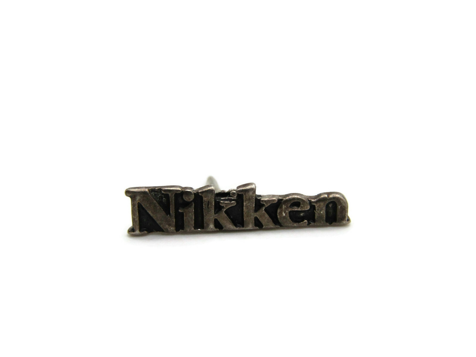 Vintage Nikken Lapel Pin Tie Tack Logo Wordmark Silver Tone Metal Promotional