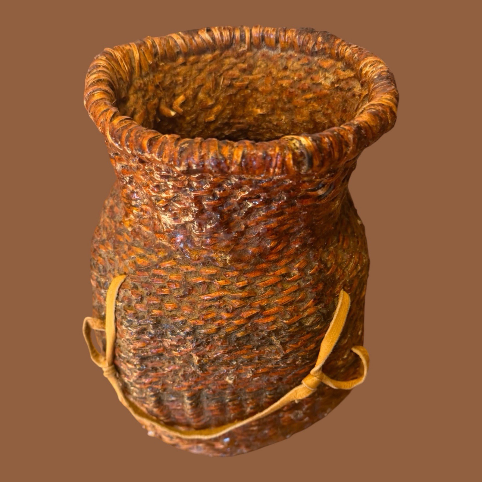 Apache coiled pine pitch water jar (Tus) with Buckskin strap c1800 10”x7”