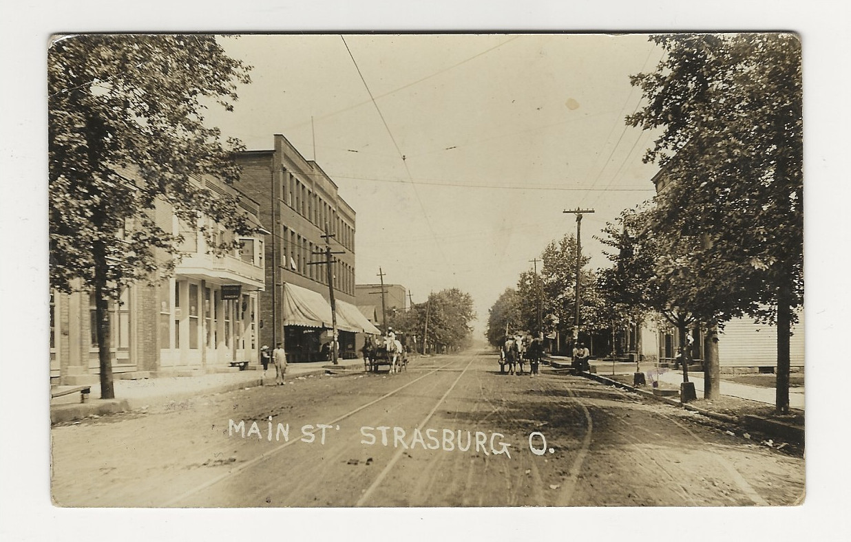 VERY NICE 1909 RPPC - Main Street in Strasburg, Ohio.