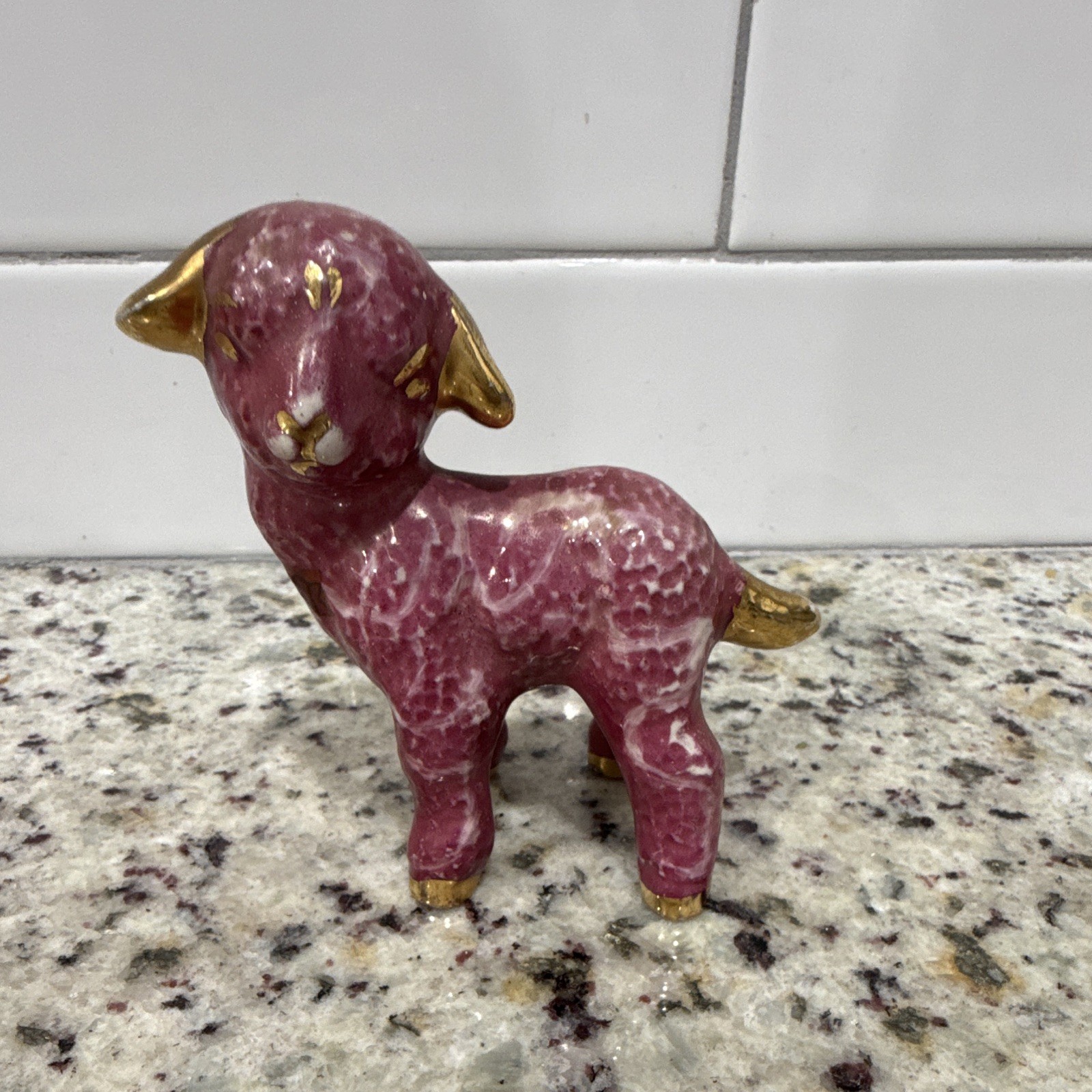 Vintage mid-20th-century pink ceramic lamb figurine. Pink glaze and gold trimmed