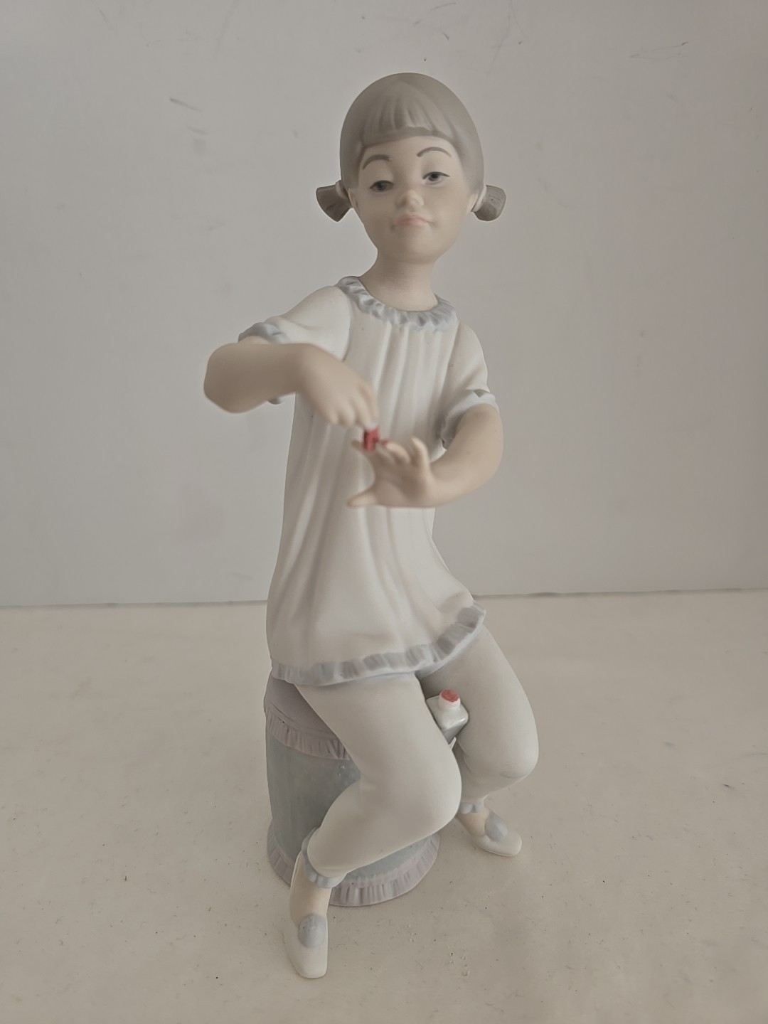 VINTAGE LLADRO YOUNG GIRL PAINTING HER NAILS WITH NAIL POLISH BISQUE 7.75 VINTAGE LLADRO YOUNG GIRL PAINTING HER NAILS WITH NAIL POLISH BISQUE 7.75