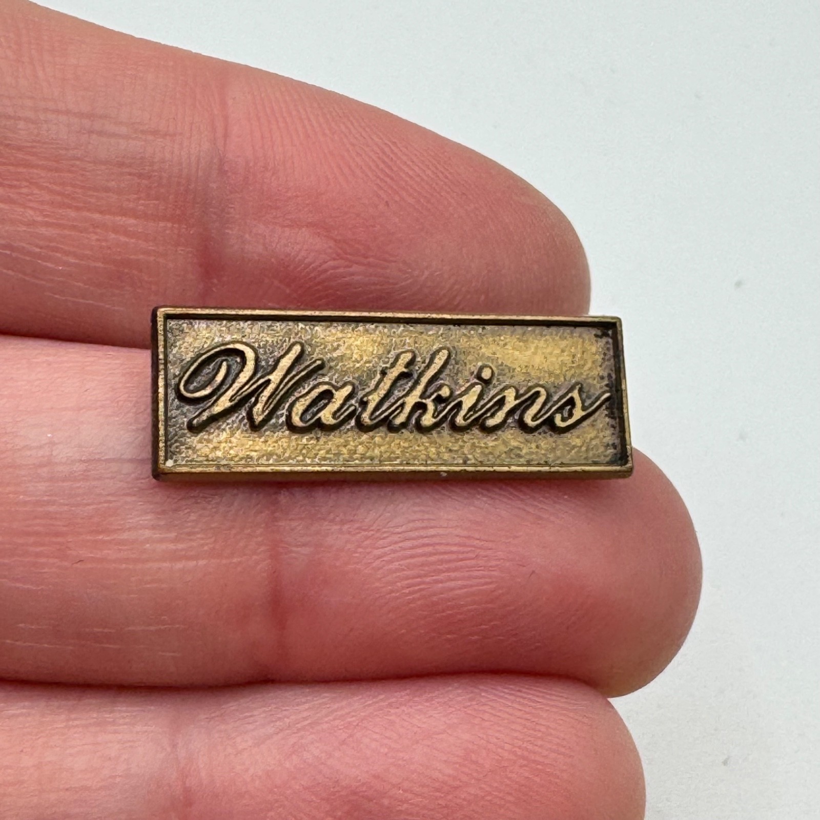 Vintage Watkins Company Script Logo Lapel Pin Antiqued Brass Tone Bar Tie Tack