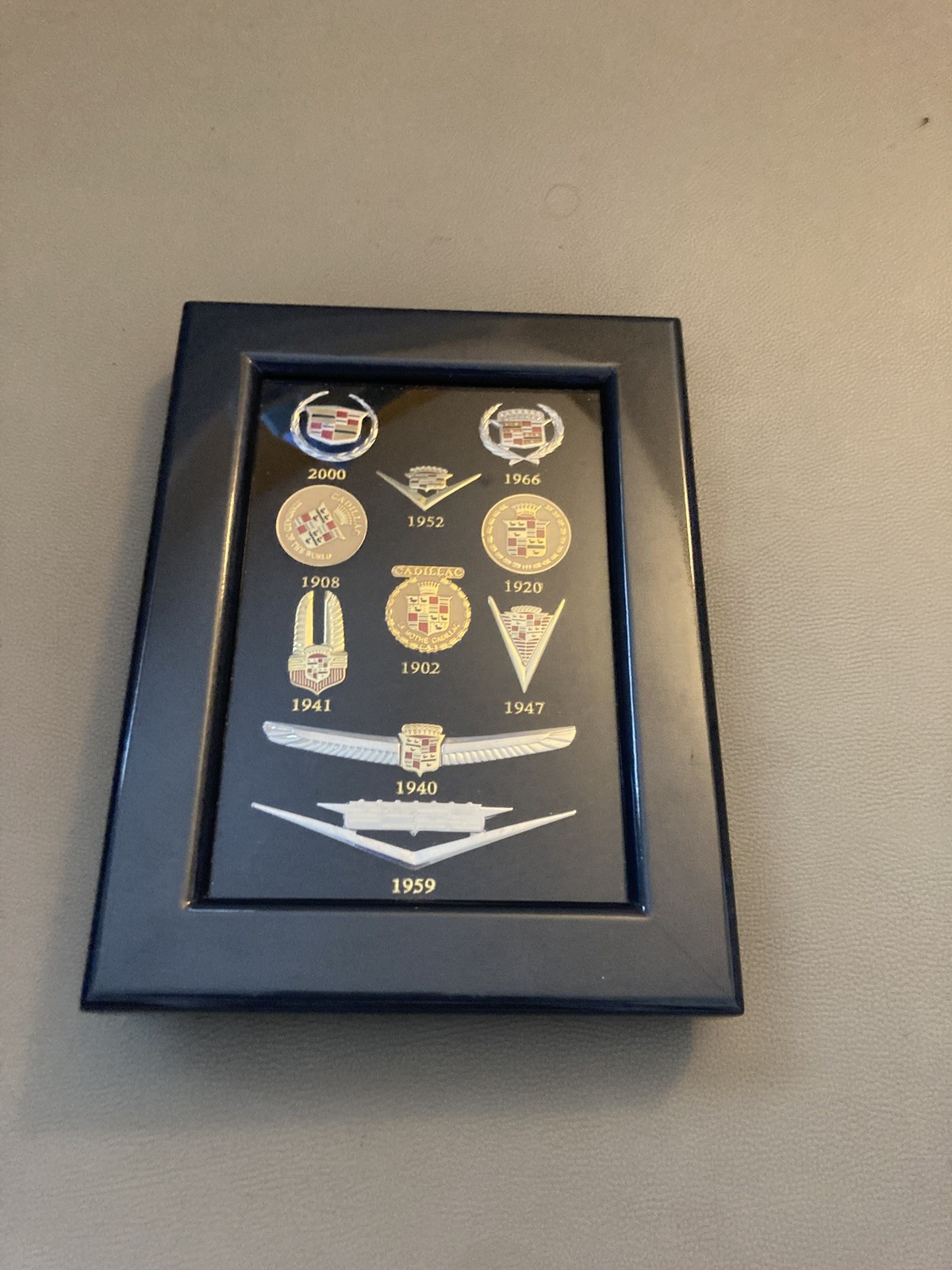VTG Licensed GM Framed Collection Of 10 Cadillac Enamel Emblem Lapel Pins 100yrs