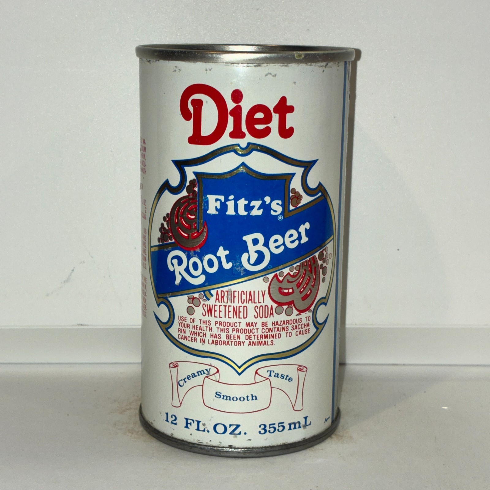 1970\'s Diet Fitz\'s Root Beer soda can, bottom opened, adhesive residue