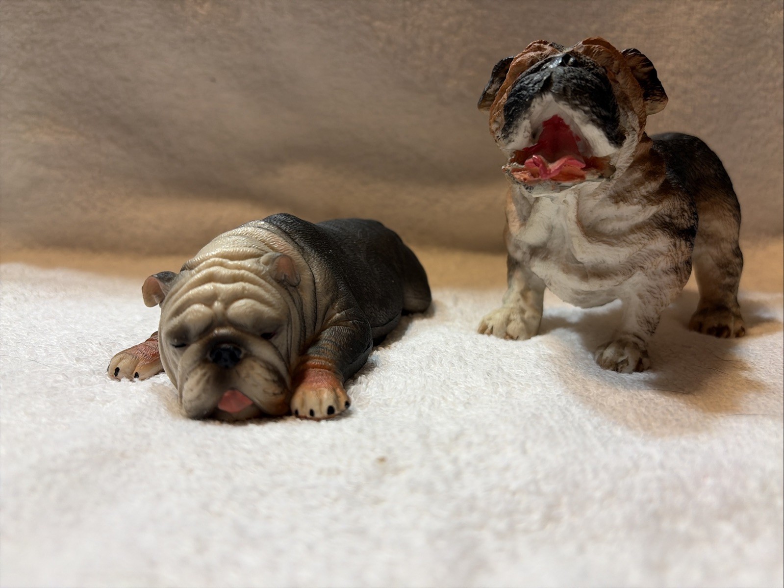 A Pair Of Bulldog Figurines For The Display. Woof