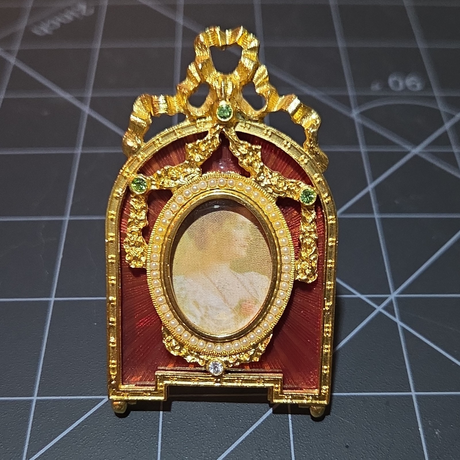 Fabergé Mini Ornate Foldable Gold Tone Metal Oval Picture Frame, Red Enamel