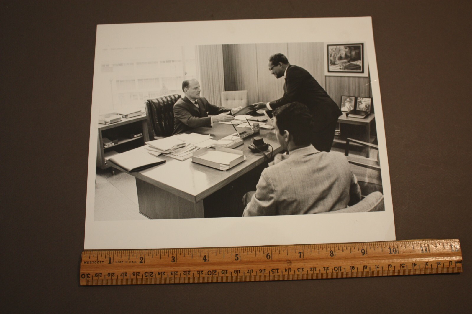 VTG B&W PHOTOGRAPH AFRICAN AMERICAN & WHITE MAN HANDING PLAQUE BEHIND DESK