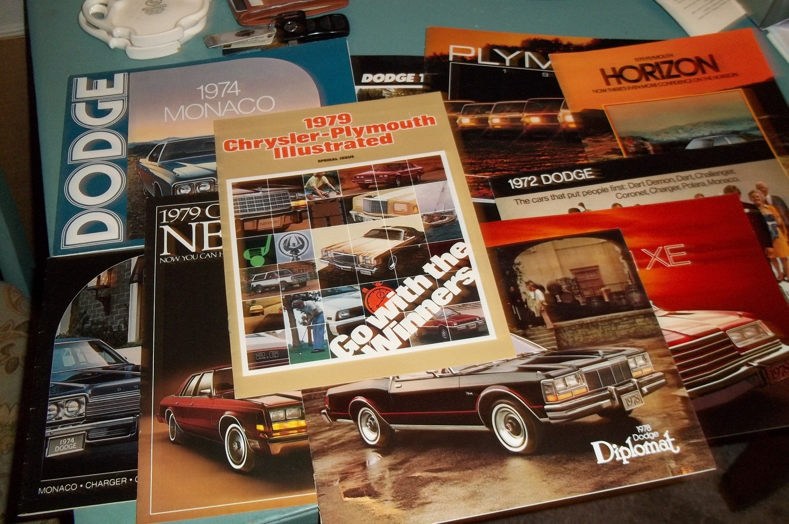 Lot  of  11  Original Plymouth/Dodge Dealer Sales Brochures/Ads  1978-1989  NOS