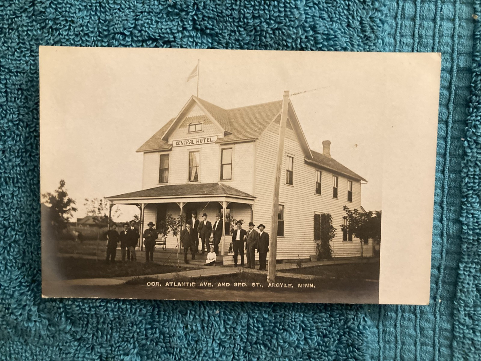 RPPC Argyle Minnesota Central Hotel Many Excited People Gather Outside c1910