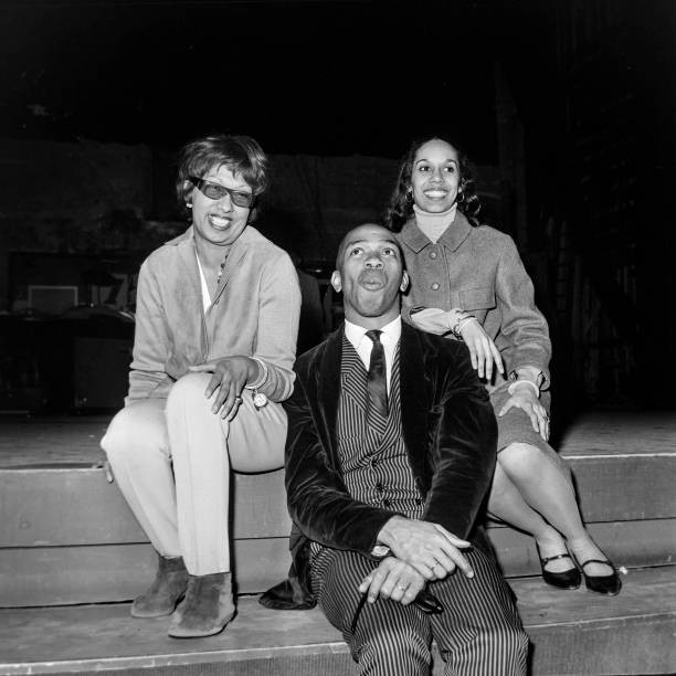 Josephine Baker sitting the edge of the stage of the Olympia durin- Old Photo