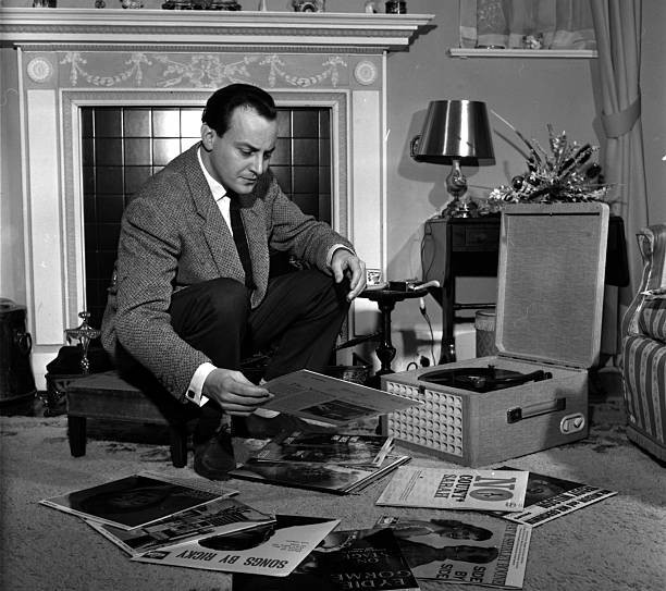 England Disc Jockey David Jacobs pictured looking through record c- Old Photo