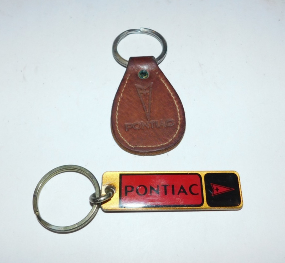 2 NEAT VINTAGE PONTIAC CAR KEYCHAINS