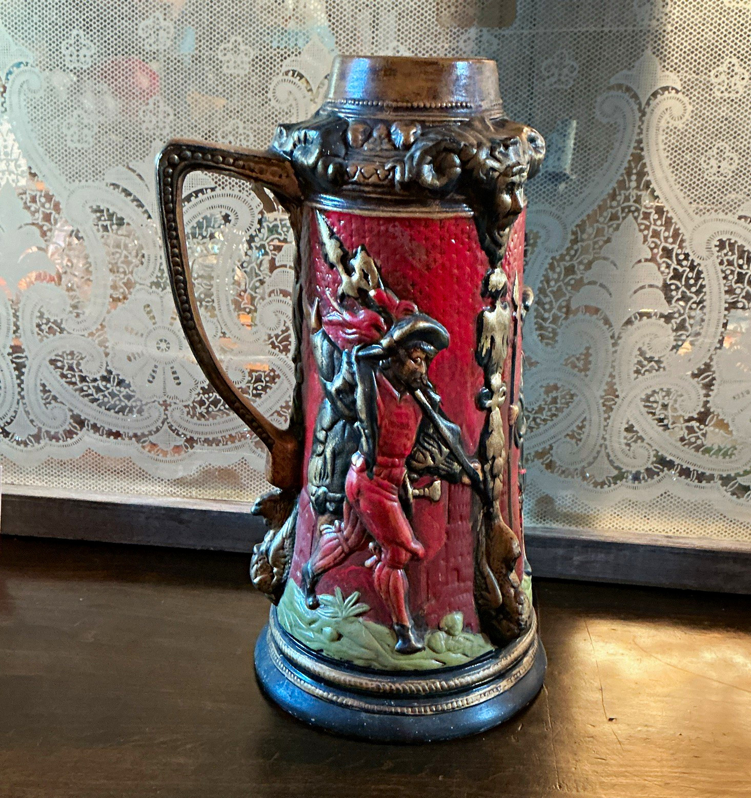 Vintage German ceramic beer stein featuring Renaissance lansquenet figures