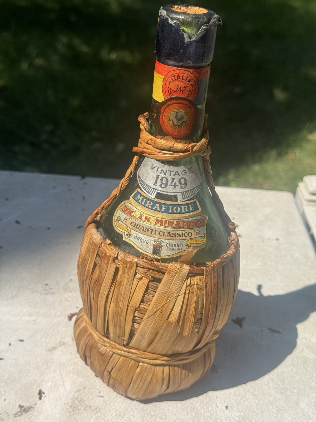 Vintage unique bottle 1949 Mirafiore producer in Greve, Tuscany, Straw Wrapped Vintage unique bottle 1949 Mirafiore producer in Greve, Tuscany, Straw Wrapped