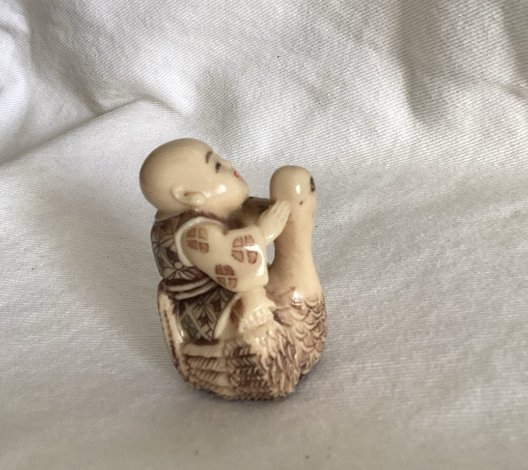 Vintage Netsuke-Style Figurine of a Monk Riding on a Goose