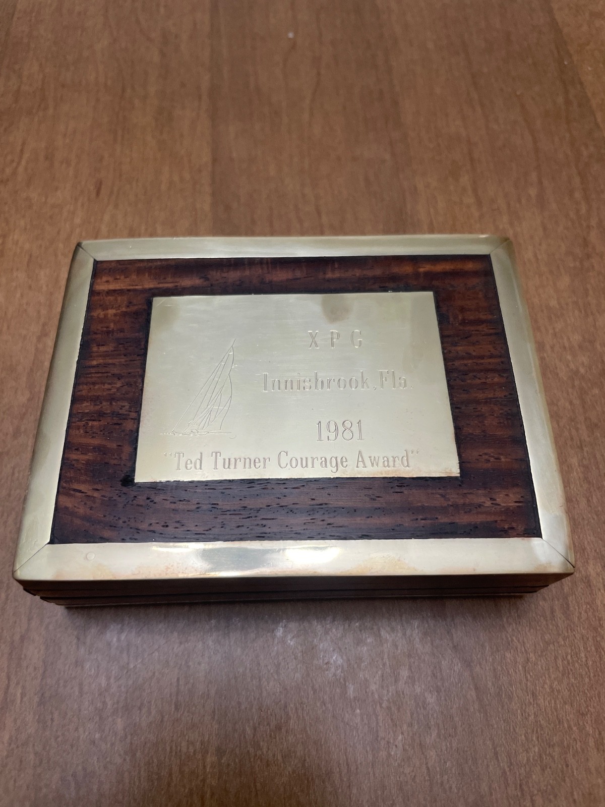 Ted Turner courage award. Wood and brass box 3”x3 3/4”