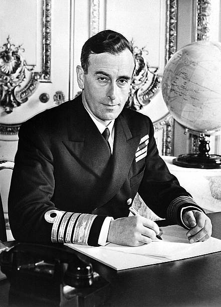 An undated unlocated photo shows Lord Mountbatten posing desk Moun- Old Photo