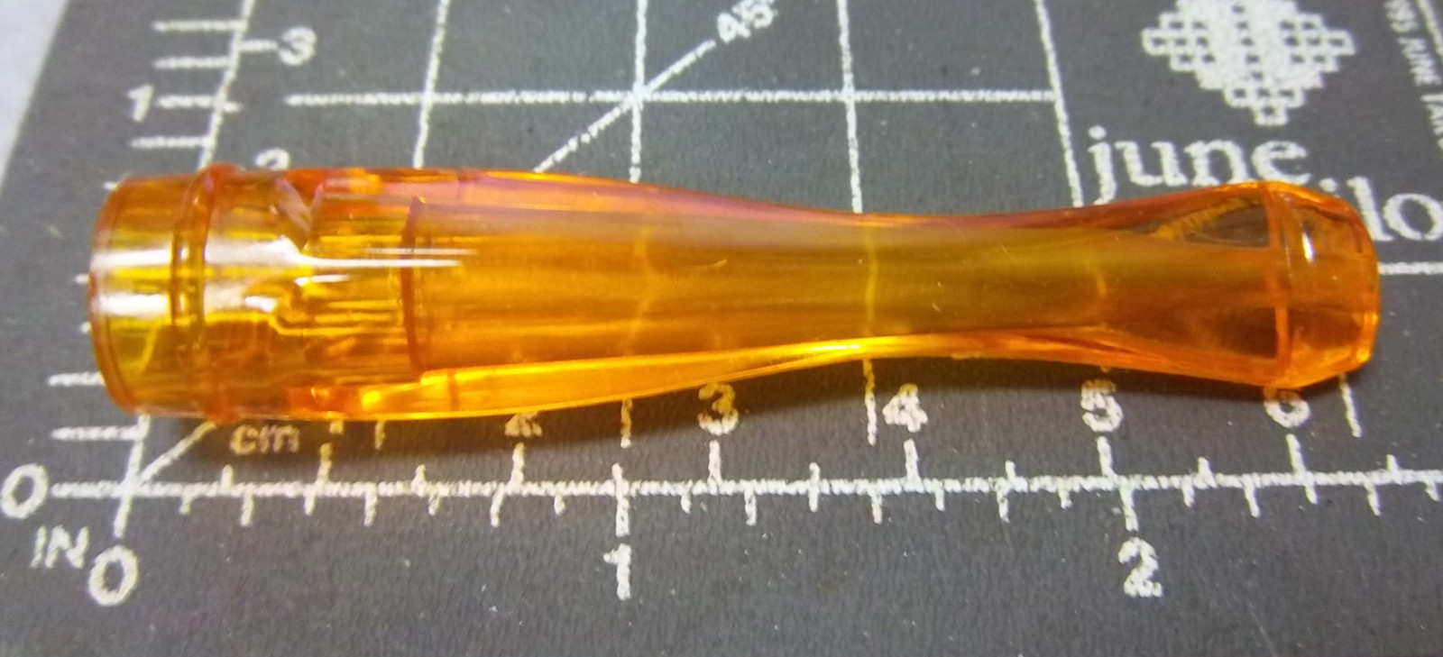 Vintage 1940-50s amber color hard plastic cigarette holder, new & unused