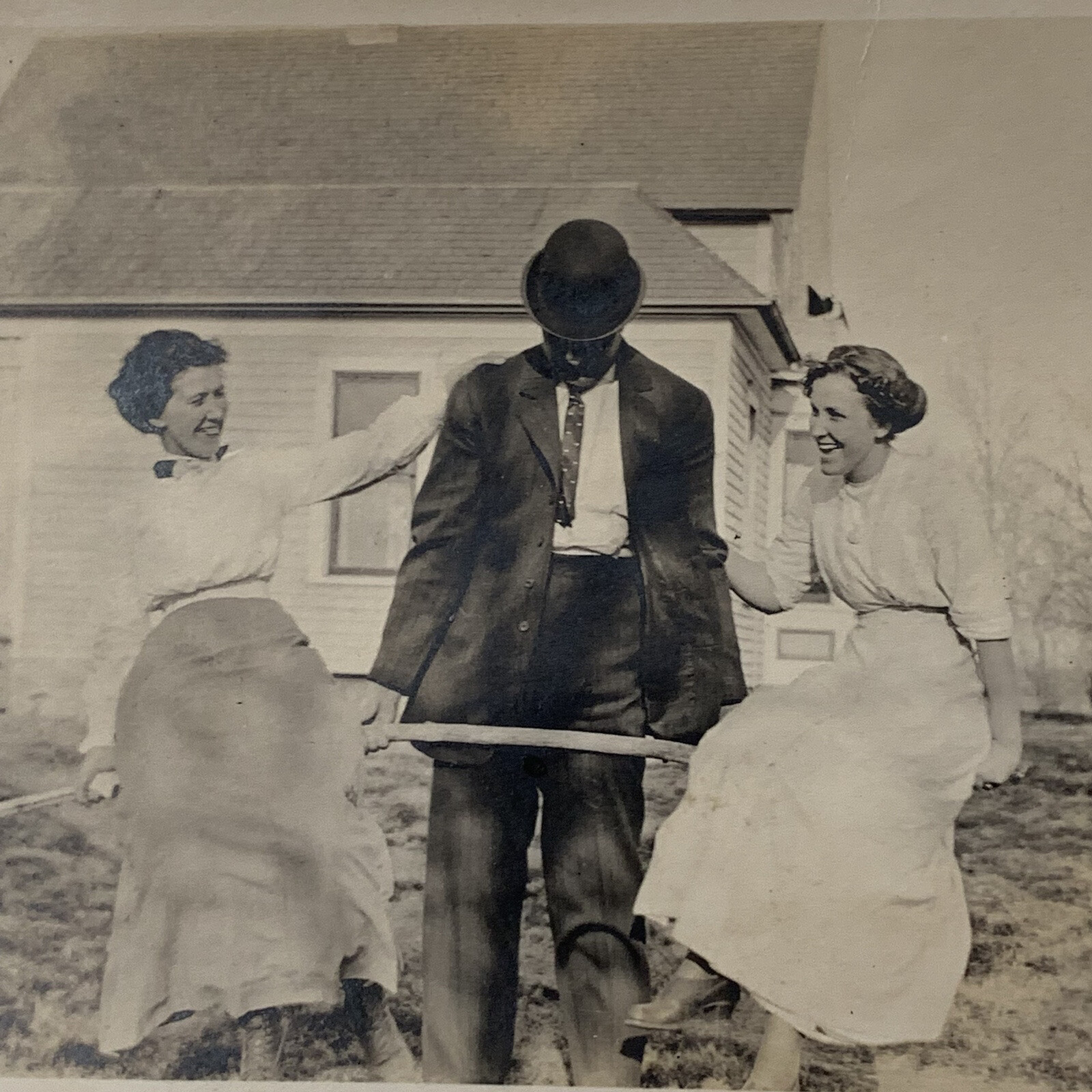Antique B&W Snapshot Photo Beautiful Young Women Twins? Man Lifting Fun Silly