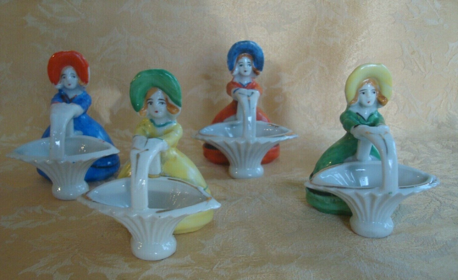 4 Vtg Japan Porcelain Girl W Hat Holds Basket Figurines ~ Red/Blue/Green/Yellow